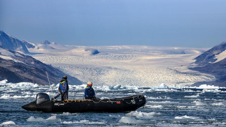 Tourists exploring the Kangerlussuaq Fjord in zodiac, Southeast coast, Greenland