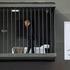 Person dressed up as US President Donald Trump performs inside mock prison cell in Tehran