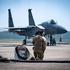 U.S. Air Force Tech. Sgt. Jose Hernandez, a fuels specialist assigned to the 103rd Airlift Wing, prepares begin refueling an F-15 Eagle flown by the 104th Fighter Wing in Massachusetts during a Distributed Integrated Combat Turn (D-ICT) operation at Westo