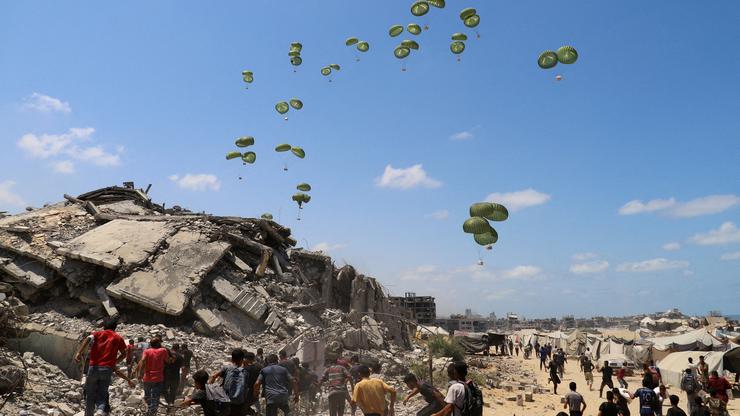 FILE PHOTO: Aid packages are airdropped over Gaza