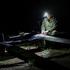 A Ukrainian serviceman prepares a multifunctional unmanned aerial vehicle before flying it over positions of Russian troops, amid Russia's attack on Ukraine, near the frontline in Donetsk region