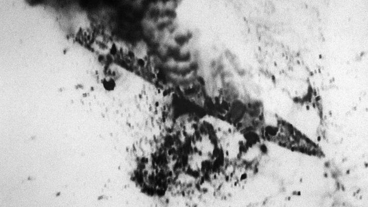 The Iranian frigate IS Alvand (71) burns after being attacked by aircraft from Carrier Air Wing 11 during Operation Praying Mantis, conducted in retaliation for the mining of USS Samuel B. Roberts (FFG-58).