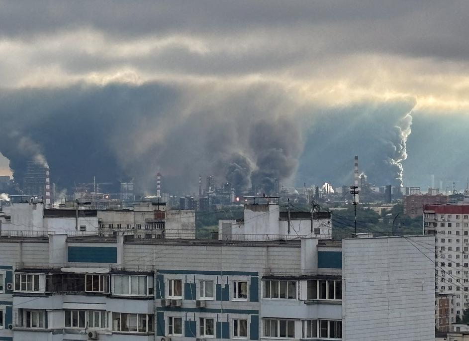 FILE PHOTO: Thick plumes of smoke with flames rise from an oil refinery in Moscow