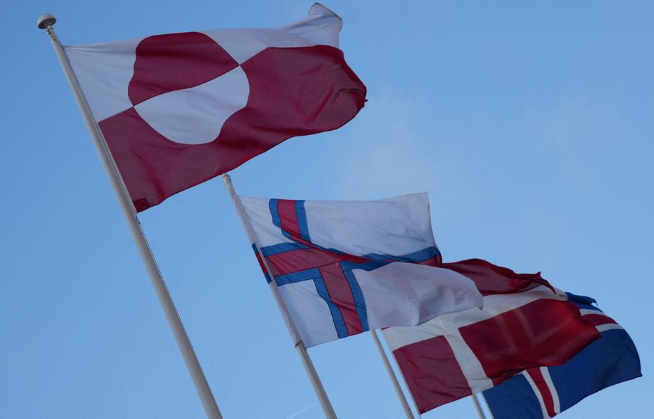 The flags of Greenland, the Faroe Islands, Denmark and Iceland flutter outside North Atlantic House in Copenhagen | Author: Tom Little