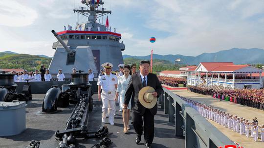North Korean leader Kim Jong Un attends the launching ceremony of a warship that had been damaged upon its first attempt to launch