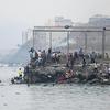 Migrants cross the border swimming through the sea, in Ceuta