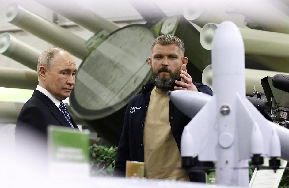 Russian President Vladimir Putin tours the exhibition "Everything for Victory" organised by People's Front, in Moscow