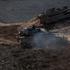 Israeli military vehicles manoeuvre along the Israel-Lebanon border as seen from northern Israel