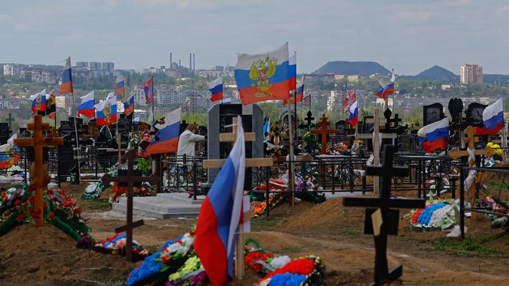 People visit a cemetery in Donetsk