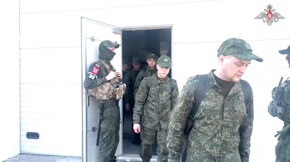 A still image from video, released by the Russian Defence Ministry, shows what it said to be captured Russian service personnel walking to a bus following the latest exchange of prisoners of war | Author: Russian Defence Ministry