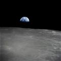 Earthrise - the crescent earth rising above the limb of the moon