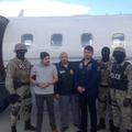 FILE PHOTO: Handout photo of Efrain Antonio Campo Flores and Franqui Fancisco Flores de Freitas stand with Haitian law enforcement officers in this November 12, 2015 photo after their arrest in Port Au Prince, Haiti.