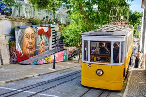 Gloria Funicular hill yellow tram, street art, city of Lisbon, Portugal