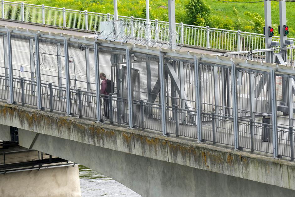A man walks on bridge over Narva river in Narva | Author: Ints Kalnins