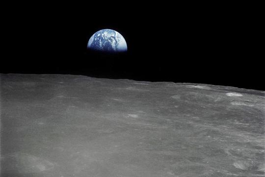 Earthrise - the crescent earth rising above the limb of the moon