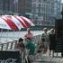 Dublin, Ireland  -  13th August 2025 - An outdoor coffee dock with seating and parasols on the Boardwalk along the River Liffey in Dublin city centre as the Irish capital experiences high temperatures and humidity