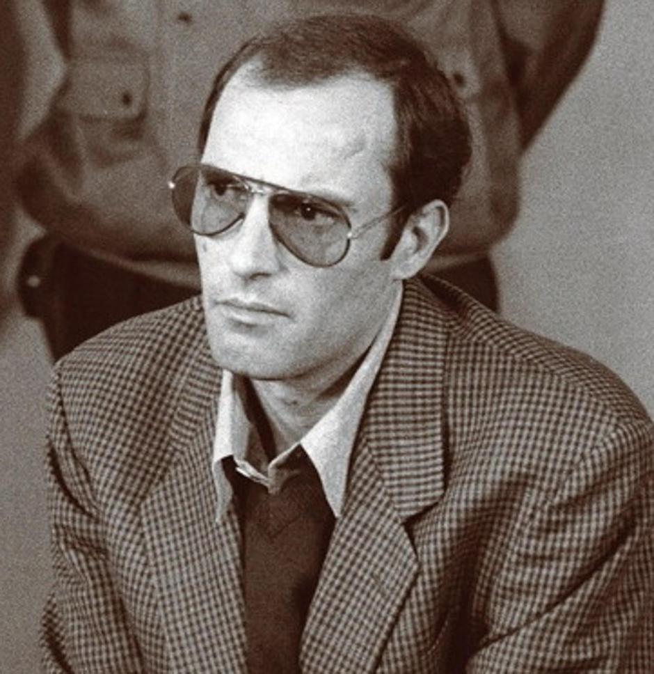 This photograph shows Nicu Ceaușescu, son of Nicolae Ceaușescu and Elena Ceaușescu, captured during his 1990 legal proceedings at the Bucharest Military Tribunal following the Romanian Revolution of 1989. AGERPRES Foto+1 Nicu had held senior positions in  | Author: 