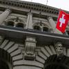 FILE PHOTO: A Swiss flag hangs at the Swiss Parliament building (Bundeshaus) in Bern