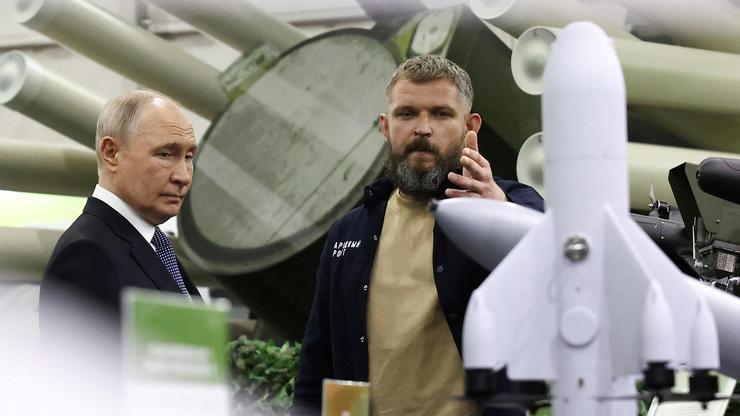 Russian President Vladimir Putin tours the exhibition "Everything for Victory" organised by People's Front, in Moscow