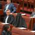 Senators react as One Nation leader Hanson wears a burqa in the Senate chamber at Parliament House in Canberra
