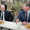 FILE PHOTO: Russian President Putin and Defence Minister Ivanov have coffee in Moscow
