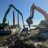 FILE PHOTO: Excavators load rocks onto barges in Izvoarele, Romania