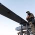 Ukrainian serviceman stands next to FP-1 deep-strike drones before their launch for a combat mission in an undisclosed location in Ukraine