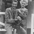An image of country music icons Porter Wagoner and Dolly Parton, captured together, showcasing their collaboration in the country music industry.