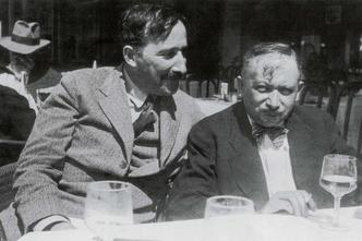 A photograph taken in the summer of 1936, featuring authors Stefan Zweig and Joseph Roth on the terrace of the Italian restaurant Almondo in Ostend. The photographer is believed to be Lotte Altmann, Stefan Zweig's lover and secretary at the time.