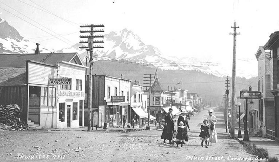 . English: Women and children on Main Street in Cordova, ca. 1912 . English: Caption on image: Main Street, Cordova, Aaa . PH Coll 247.605 Cordova is located at the southeastern end of Prince William Sound in the Gulf of Alaska. The community was built on | Author: 