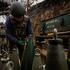 Ukrainian serviceman checks ammunition for a Bohdana self-propelled howitzer at a position on a front line in Kharkiv region
