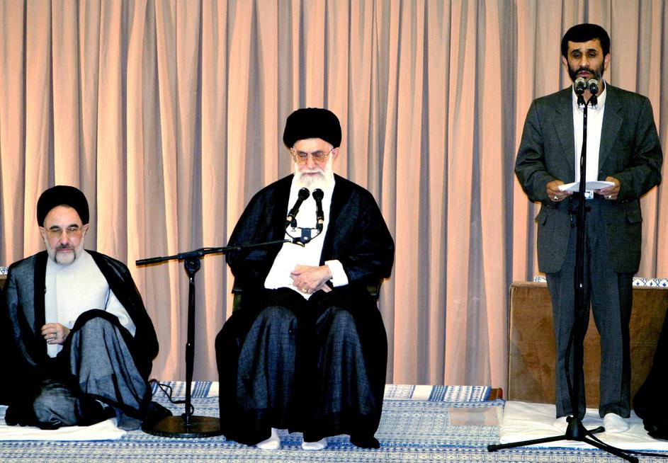 Iran's Supreme Leader Ayatollah Ali Khamenei (C) and former president Mohammad Khatami listen to a s..