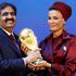 FILE PHOTO: File picture shows Qatar's Emir Sheikh Hamad and his wife Sheikha Moza holding a copy of a World Cup trophy in Zurich
