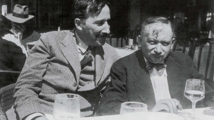 A photograph taken in the summer of 1936, featuring authors Stefan Zweig and Joseph Roth on the terrace of the Italian restaurant Almondo in Ostend. The photographer is believed to be Lotte Altmann, Stefan Zweig's lover and secretary at the time.
