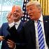 FILE PHOTO: U.S. President Donald Trump holds red card as he meets with FIFA President Infantino in the Oval Office of the White House in Washington