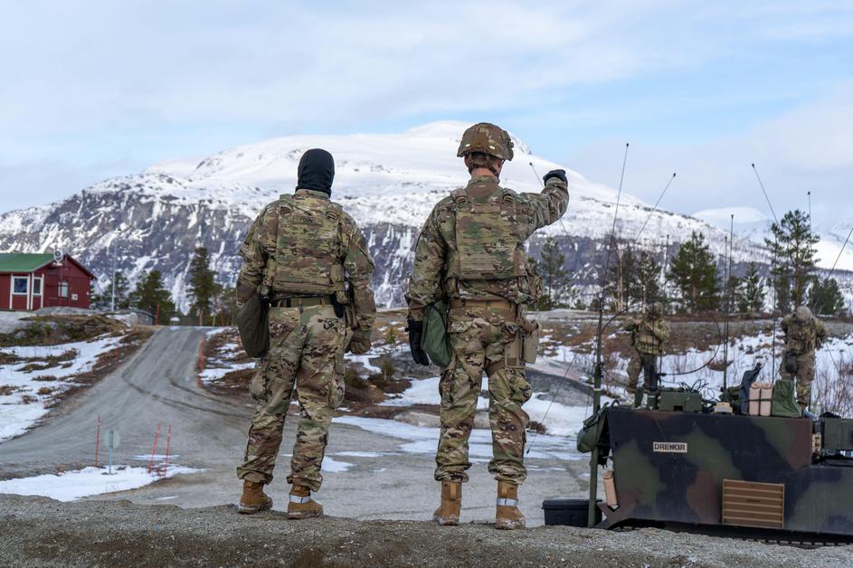 Capt. Andrew Young and 1st Sgt. Dain Cox, assigned to Headquarters and Headquarters Battery, 1st Battalion, 6th Field Artillery Regiment, 41st Field Artillery Brigade familiarize themselves with the terrain around their tactical action center (TAC) during