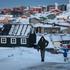 A man walks along a road on the day of the meeting between top U.S. officials and the foreign ministers of Denmark and Greenland, in Nuuk