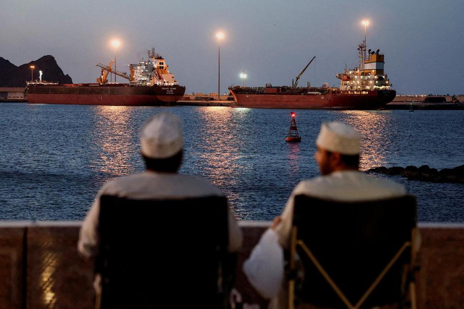 FILE PHOTO: Galaxy Globe bulk carrier and Luojiashan tanker sit anchored in Muscat