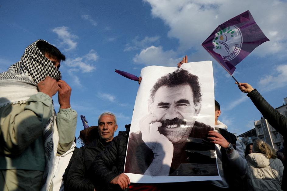 FILE PHOTO: A demonstrator holds a picture of jailed Kurdish militant leader Ocalan