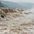 YAN AN, CHINA - SEPTEMBER 20: A large number of tourists visit the Hukou Waterfall on the Yellow River as water volume s