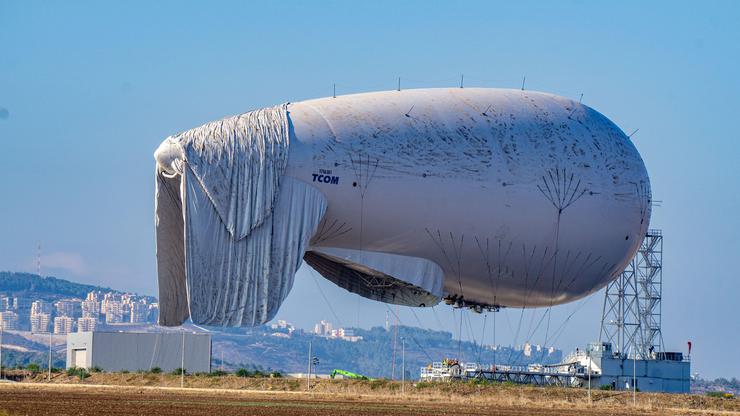 GIVAT AVNI, ISRAEL - NOVEMBER 3, 2021: Israel's deffence force launches a massive reconnaissance surveillance balloon to detect aerial threats at long