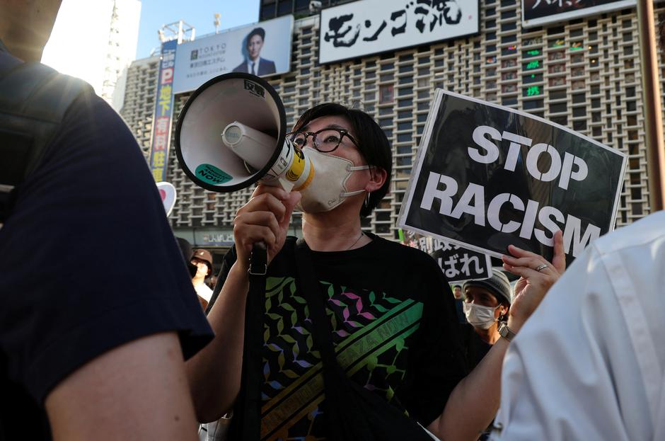 A woman protesting against the Sanseito party shouts slogans as the party holds a rally in Tokyo | Author: Kim Kyung-Hoon