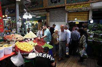 People walk at Tajrish Bazaar in Tehran