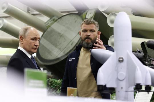 Russian President Vladimir Putin tours the exhibition "Everything for Victory" organised by People's Front, in Moscow