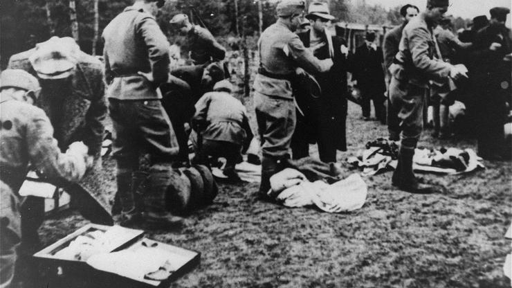 Ustase guards stealing the possessions of newly arrived prisoners in the Jasenovac concentration camp. Jasenovac was a camp system  in Croatia that included forced labour camps as well as the specific killing site at Donja Gradina). An estimated 500,000 p