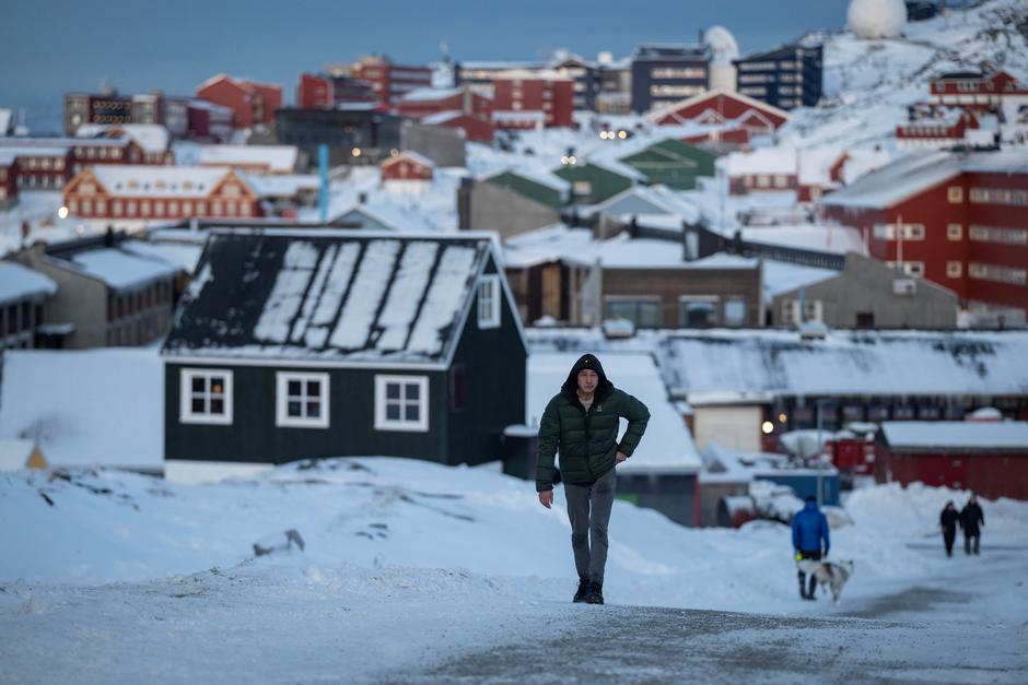 A man walks along a road on the day of the meeting between top U.S. officials and the foreign ministers of Denmark and Greenland, in Nuuk | Author: Marko Djurica