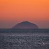 UK: WEATHER Troon , Ayrshire, Scotland 01st March 2022, the warm sun sets over ailsa craig and the goat fell tonight as we get closer to welcoming spring