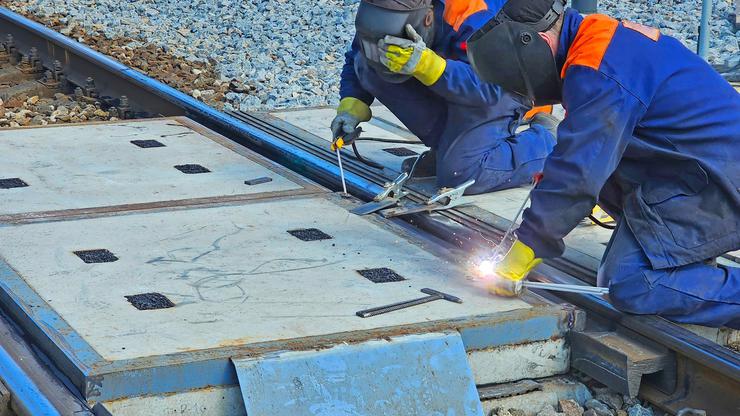 a two welders at a construction site