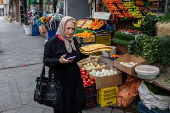 Tehranis shopping during bomb raids