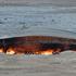 Pictured:  Vistors along the edge of the gas craterA photographer was confronted with an amazing inferno as he visited a gas crater which locals call 'The Gates of Hell' - because it has been burning for 46 years.